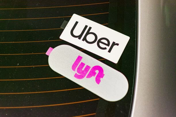 Vehicle with uber and lyft stickers
